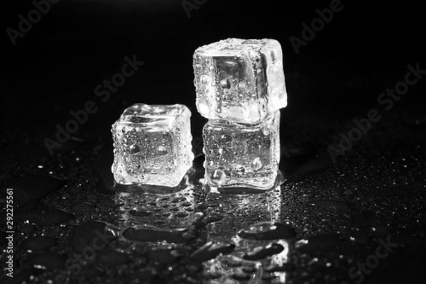 Fototapeta ice cubes on black table background.