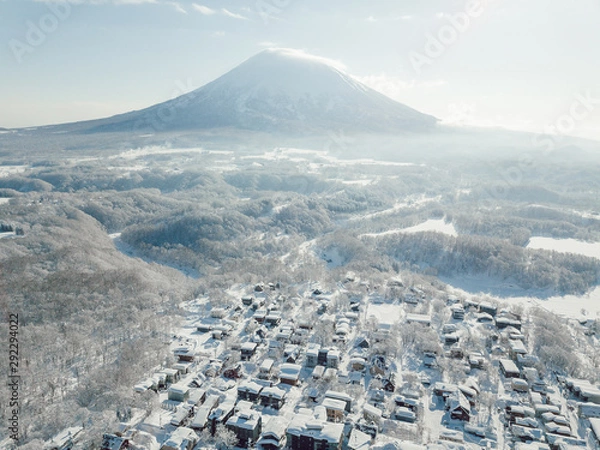 Obraz Winter in Niseko, Japan. A blue bird kind of day at Grand Hirafu, Niseko Ski Resort. Photos were taken with a drone overlooking the Grand Hirafu area with views of Mt. Niseko-Annupuri. and Mt. Yotei.
