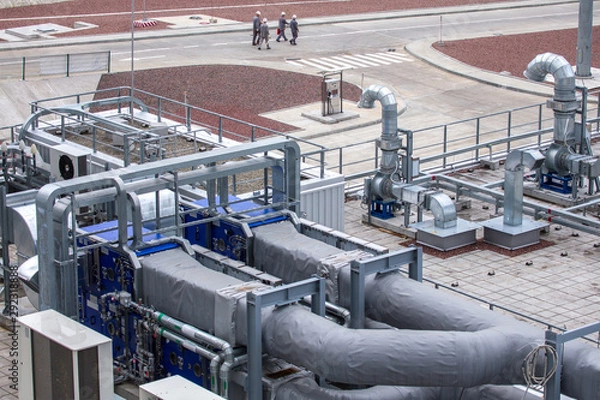 Obraz External infrastructure of the microclimate support system at a large industrial site. Air pipelines inlet and exhaust. Fans and air conditioning. Systems of control of pressure, humidity, temperature