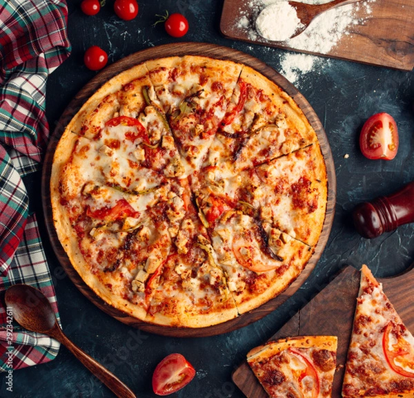 Fototapeta Chicken pizza with tomato, bell peppers, mushroom, and cheese