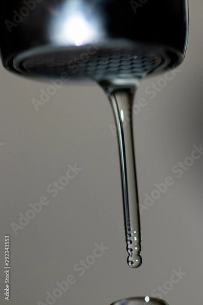 Fototapeta Water flowing from faucet