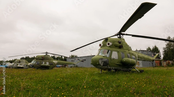 Fototapeta Old helicopter. Group of helicopters in the open air.