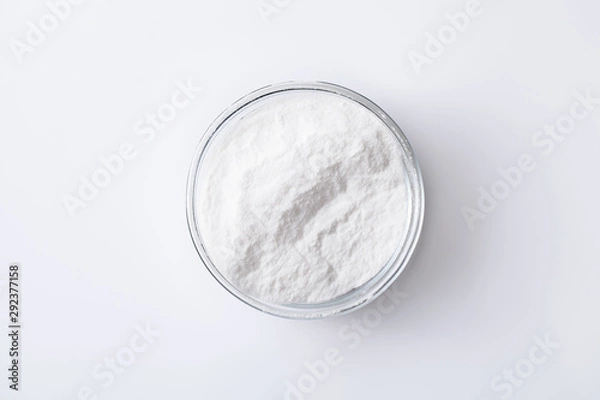 Fototapeta Baking soda in a jar and bowl on a white table