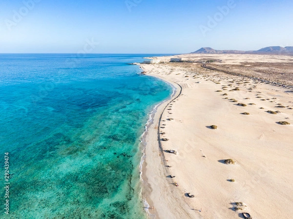 Obraz Panoramic high angle aerial drone view of Corralejo National Park (Parque Natural de Corralejo) with sand dunes located in the northeast corner of the island of Fuerteventura, Canary Islands, Spain.