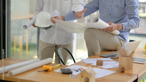 Obraz Engineers and architects are helping to design the construction.