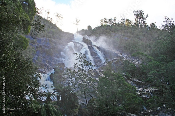 Fototapeta Cascading falls soaking me and my camera. Tasmania.