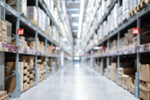 Fototapeta Warehouse inventory with packing box storage in factory. Logistic transportation storehouse concept. in blurred background.