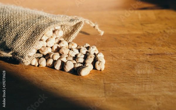 Fototapeta Chickpea bag on the wooden table