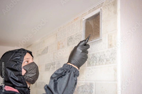 Obraz repair service man removing a dirty air filter on a house so he can replace it with a new clean. Extremely dirty and dusty white plastic ventilation air grille at home close up, harmful for health
