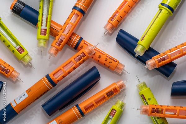 Fototapeta Stack of used insulin injectors or syringes of pen type