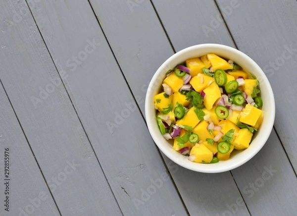 Fototapeta Homemade Mango Salsa,  top view, copy space