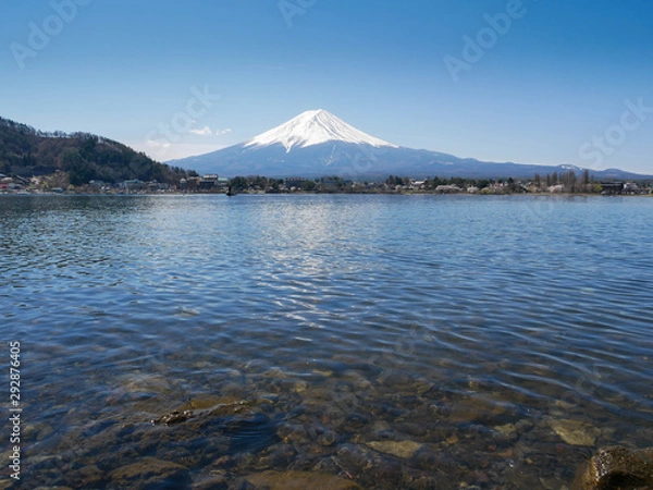 Fototapeta Natural landscape view of the Kawaguchi Lake with mount Fuji-the most beautiful vocano in Japan and rock under water in  foreground