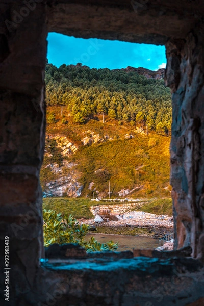 Fototapeta Pasaia San Juan, Gipuzkoa / Spain »; September 22, 2019: Looking at the nature of Jaizkibel from a window