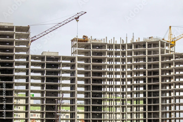 Obraz The construction of a tall frame building.