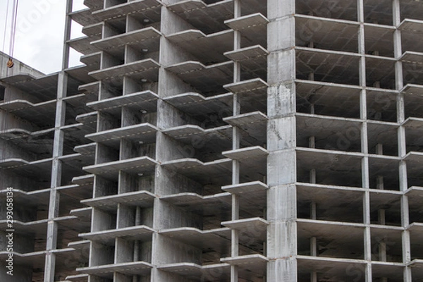 Obraz The construction of a tall frame building.