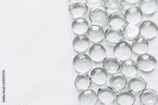 Obraz Scattered crystals on white background, beautiful gems