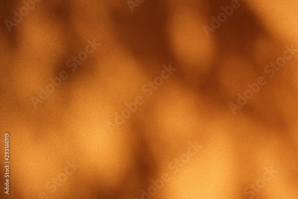 Obraz Tree shades on yellow colored wall; abstract background.