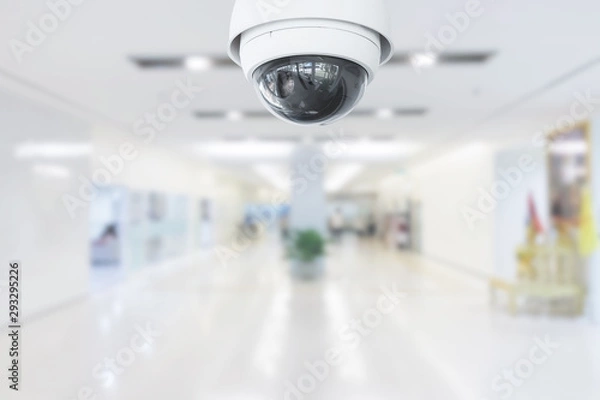 Fototapeta CCTV Security Camera operating in hospital on blur background.