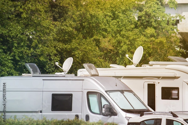 Obraz Satellite dishes on caravans. Electronic equipment on vans and campers for receiving video signals (copy space on the top of the image)