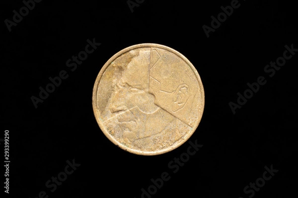 Fototapeta Old Belgian 5 francs coin from 1986, obverse showing stylized portrait of Baudouin I. Isolated on black background