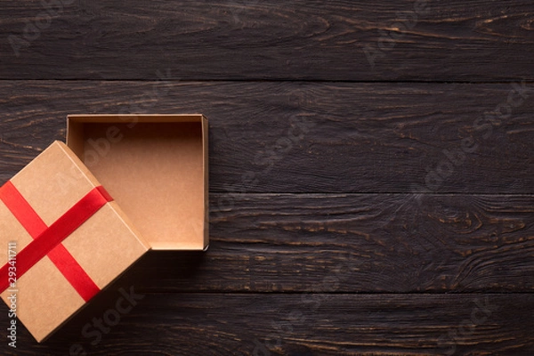 Fototapeta Empty gift box for new year present on wooden table