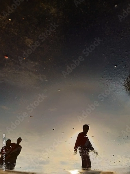 Obraz boy on beach at sunset