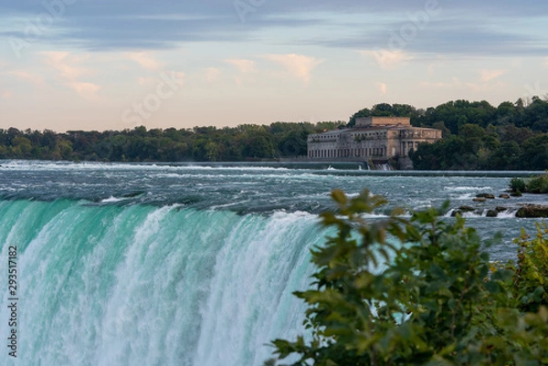 Obraz Old building by the falls