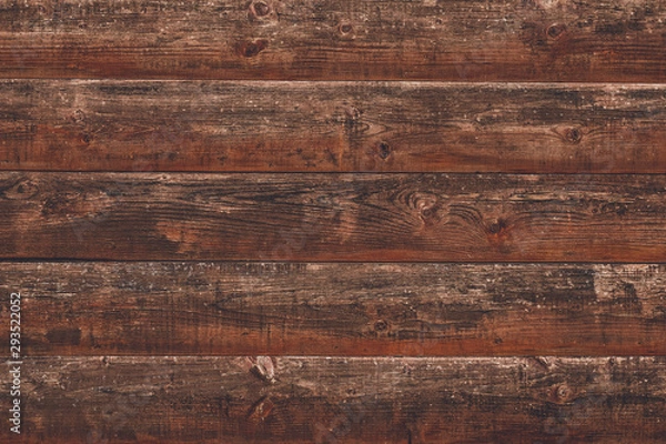 Fototapeta Shabby dilapidated log, rough wood background. Horizontal lines on wooden fence. Vintage rustic pattern of brown desk. Timber planks, scratched surface. Dirty wall backdrop, grunge texture.