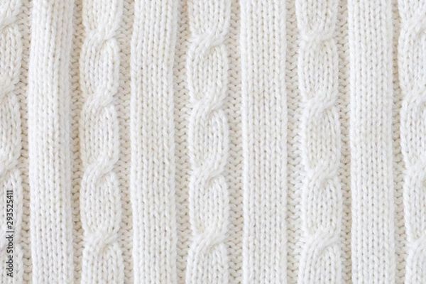 Fototapeta White vertical knitted woolen background. Knitting pattern