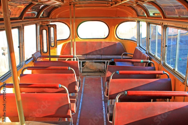 Obraz old yellow bus in vintage style on a yellow background. Urban transport. Light vintage antique grunge texture. Antique vintage grunge texture pattern. Blue sky.