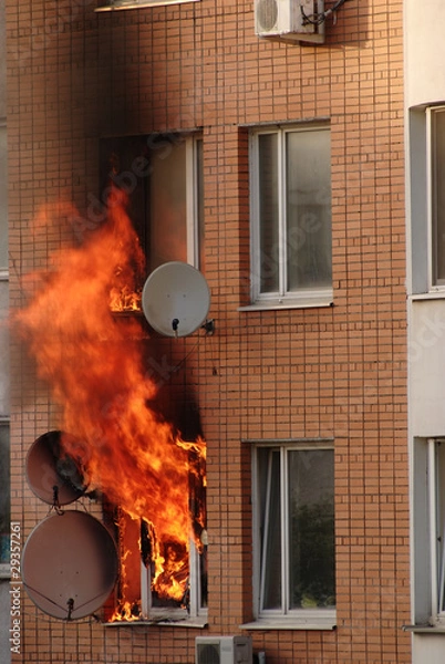 Fototapeta fire in the window of building
