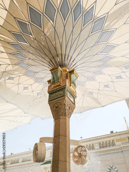 Obraz Medina, Saudi Arabia - March 22, 2018 : Exterior view of umbrella tower in Nabawi Mosque (Prophet Mosque) building in Medina. Selective focus