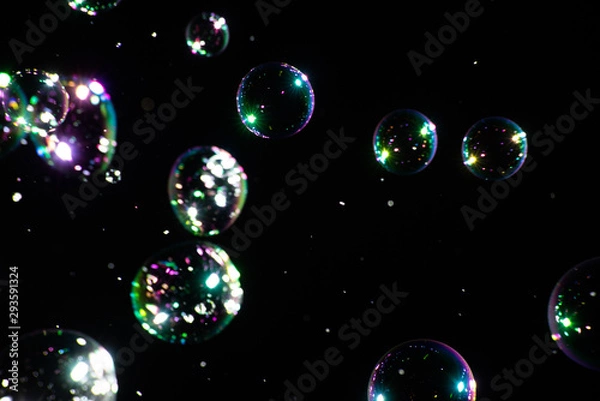 Fototapeta Many soap bubbles on a dark background