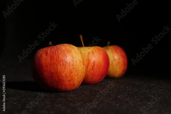 Obraz red apples on black background
