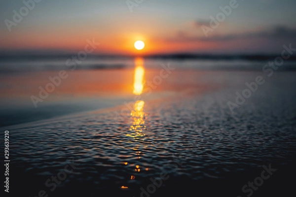 Obraz Beautiful sunset ocean view with waves and reflection. Praia da Bordeira at the Algarve Coast in Portugal, Atlantic Ocean