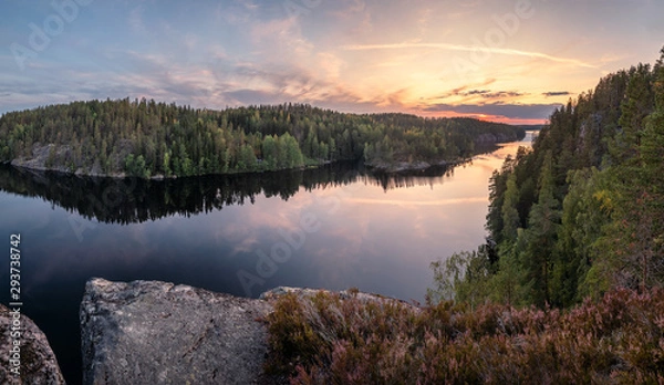 Fototapeta Scenic forest landscape with tarnquil mood and idyllic sunset at summer evening in Finland