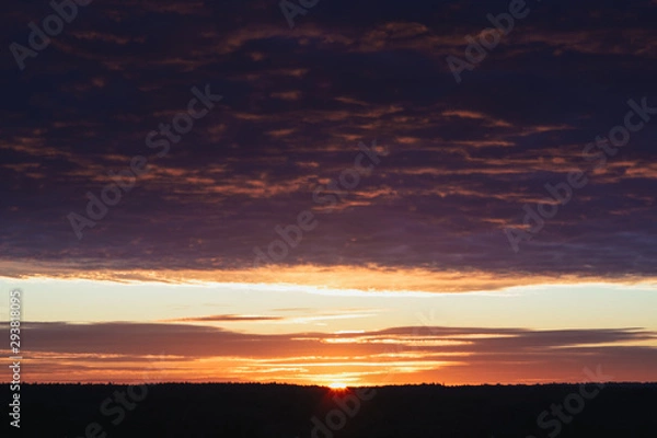 Fototapeta Dawn, field, colorful clouds, rising sun