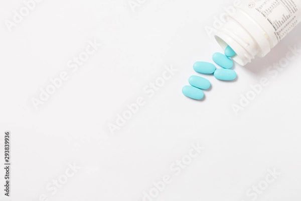 Fototapeta pills and bottle on white background