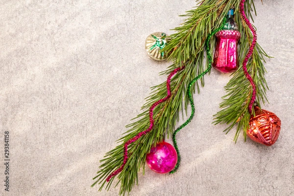 Fototapeta Vintage Christmas tree toys. New Year holiday concept. Evergreen pine branch, sunny rays