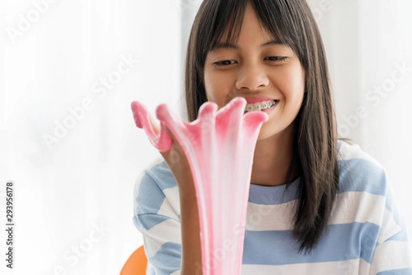 Fototapeta Hand Holding Homemade Toy Called Slime, Kids having fun and being creative by science experiment