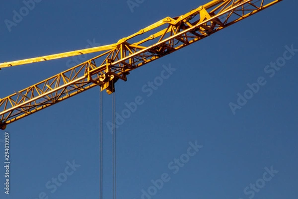 Fototapeta building crane under a blue sky