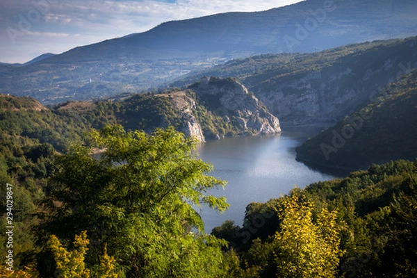 Fototapeta River surrounded by the hills and mountains. Vrbas river in Bosnia and Herzegovina.