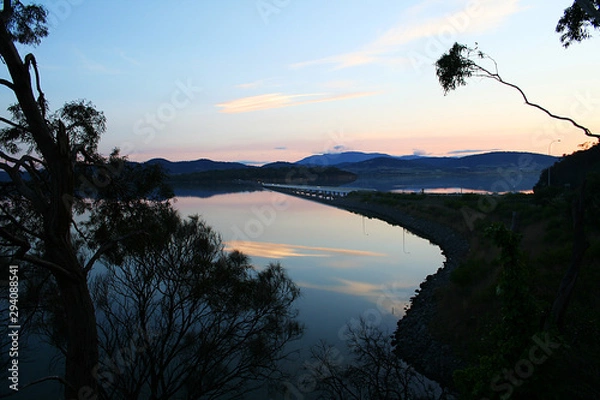 Fototapeta Reflections of clouds on the lake in the early evening. Tasmania.
