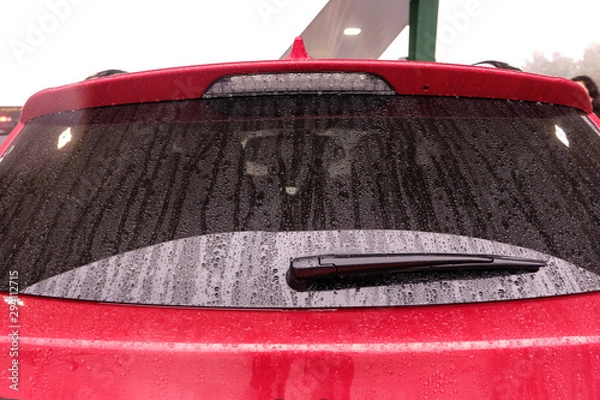 Fototapeta rainy day, view of a rear window of car
