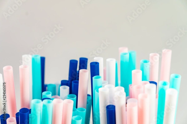Fototapeta Colorful of straw plastic drinking background for party, close up of colorful and bright plastic straws with copy space. 