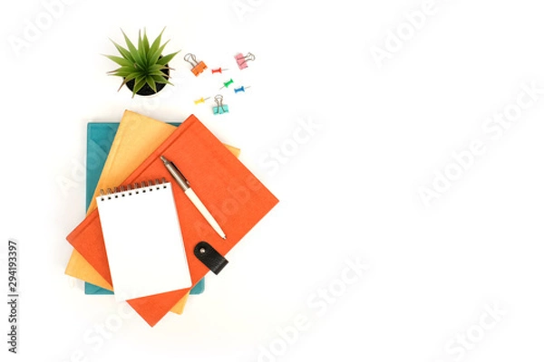 Fototapeta Black to school and education concept on white table desk with blank nodded and stack of books, supplies with copy space, flat lay, top view
