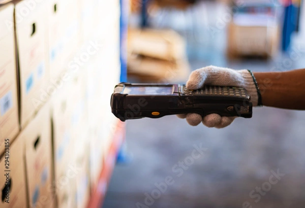 Fototapeta barcode scanner staff wearing white gloves. Barcode reader. 