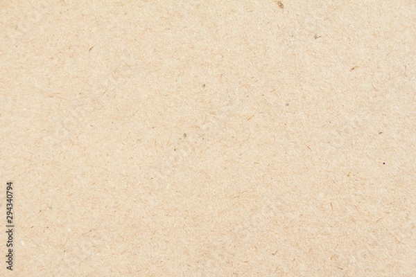 Fototapeta Closeup brown beige sheet of craft cardboard paper texture background.