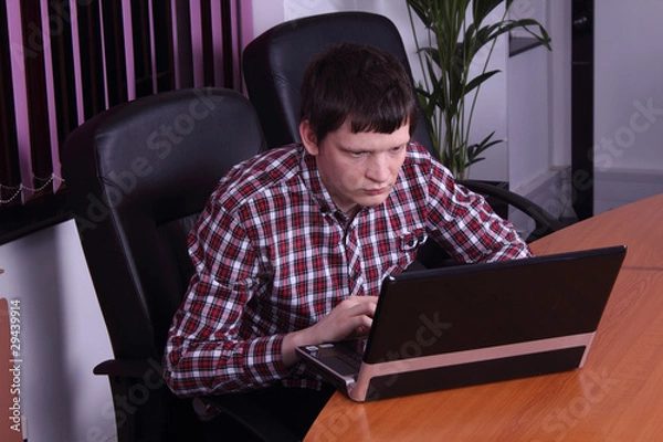 Obraz young man with a laptop