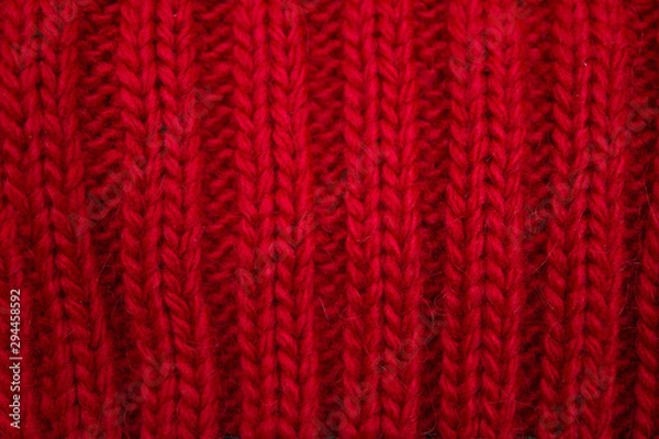 Obraz Knitted background red, close-up yarn structure
